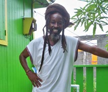Ras Bushman outside his restaurant on St. Maarten // © 2010 Mark Rogers